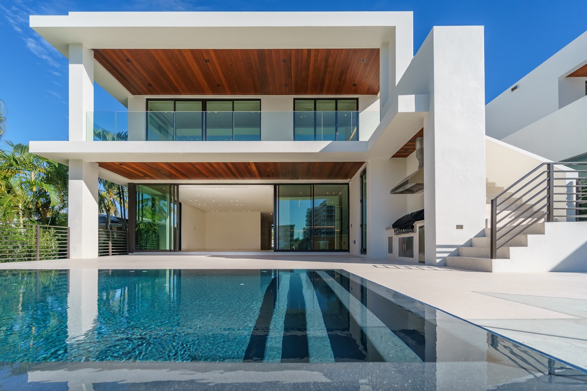 Mfalme villa glowing at dusk with an infinity pool